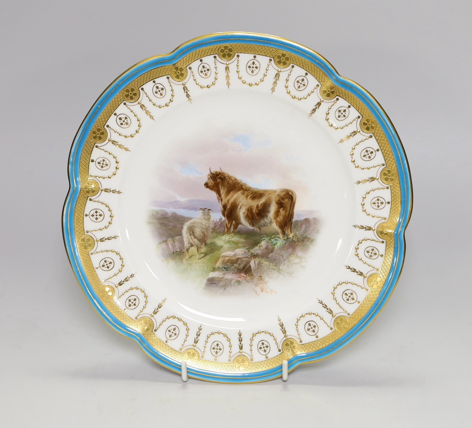 A Minton plate with turquoise, acid etched and raised gilt border painted with a bull and a sheep by Henry Mitchell, signed Henry Mitchell on the rock in the foreground, 24cm